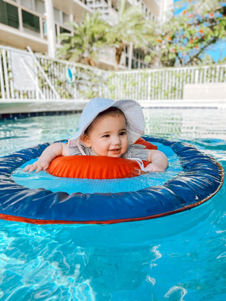 baby floating in swimming pool