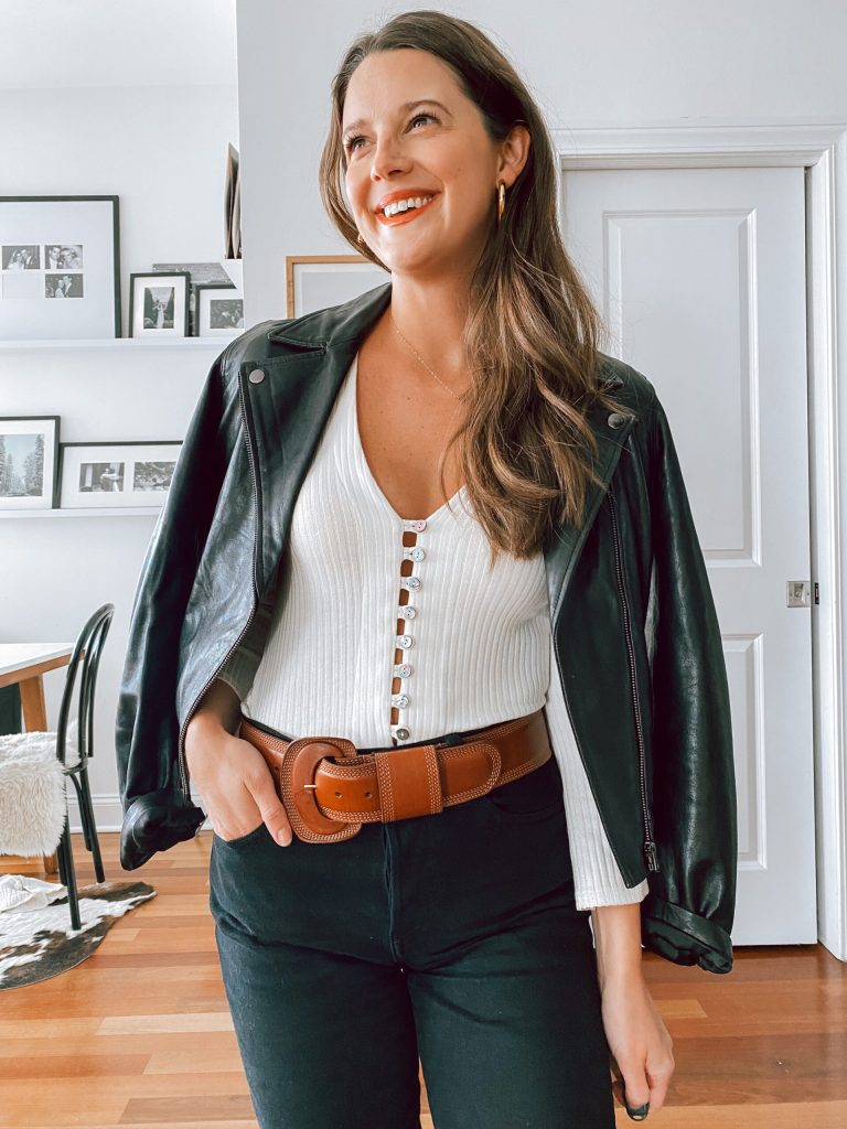 white top and leather jacket