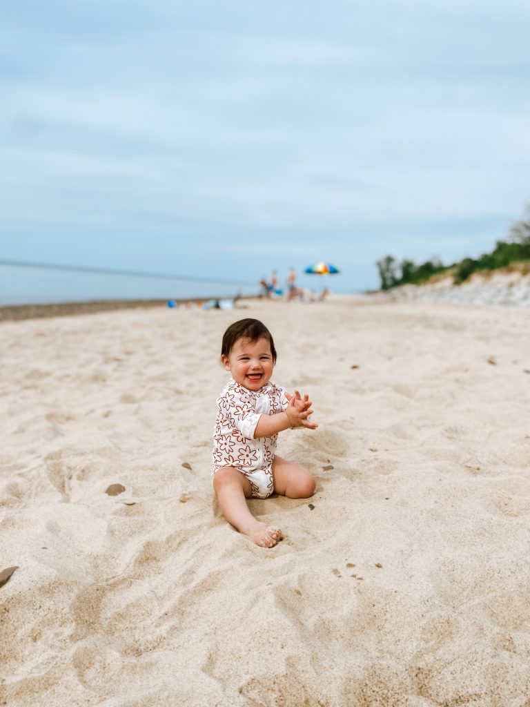 smiling baby in the sand