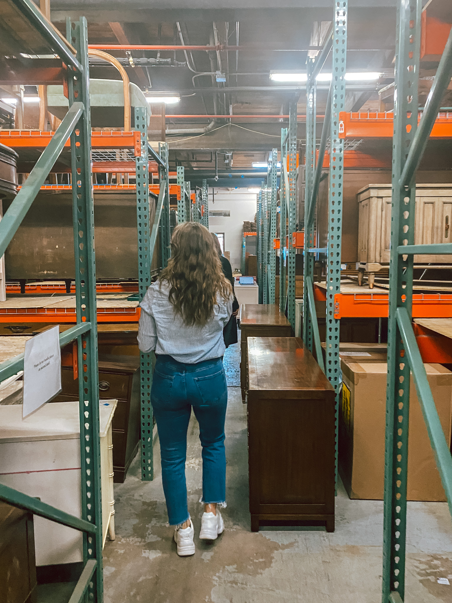 Walking with Heather and Kaylee through the warehouse