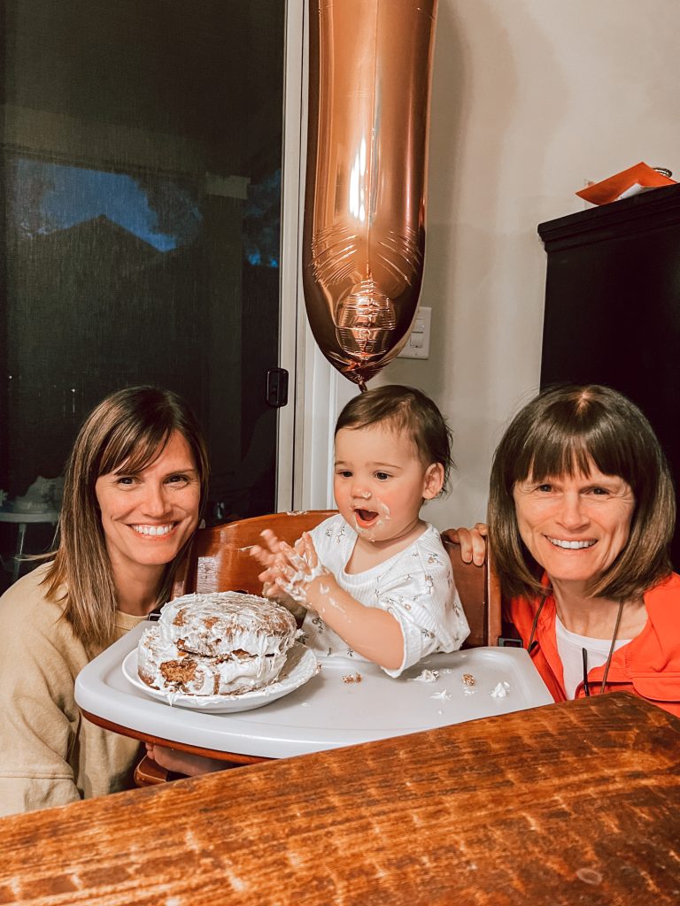 Baby messy smash cake with grandmothers