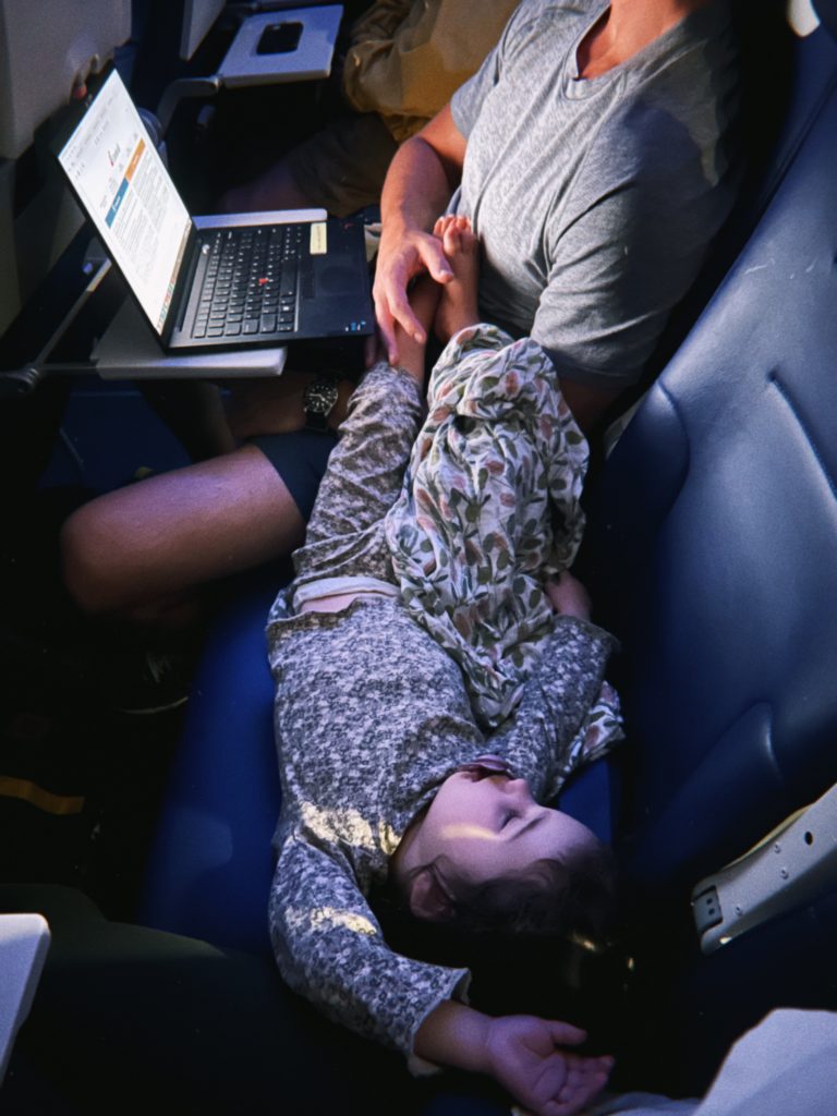 toddler sleeping on plane