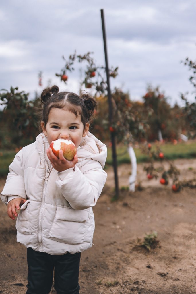 June biting on an apple