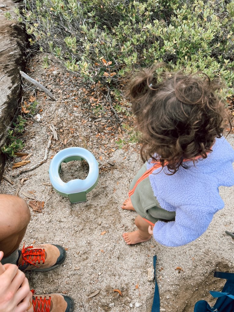 Potty training our toddler girl in Yosemite. Toddler girl with Amazon folding travel potty